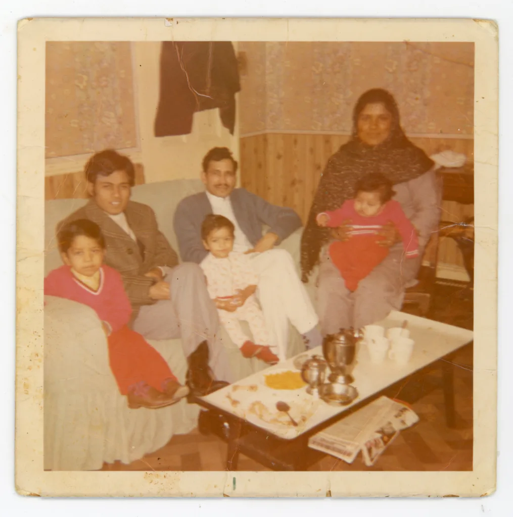 Mohammed Ashraf with family and friends, Southfield Square, c.1970